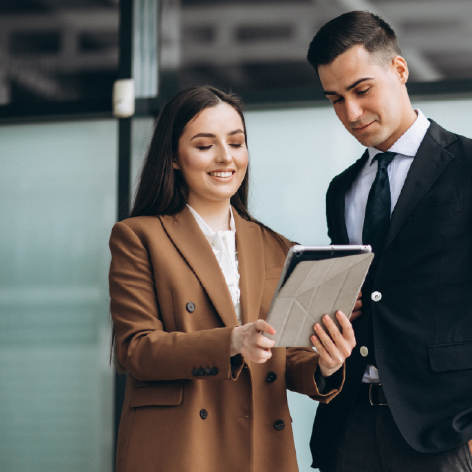 picture of two people working together